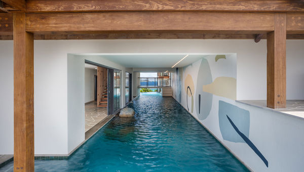 A canal-style pool weaves through indoor and outdoor areas of Moskito Island’s Cape Stout estate. A canal-style pool weaves through indoor and outdoor areas of Moskito Island’s Cape Stout estate.