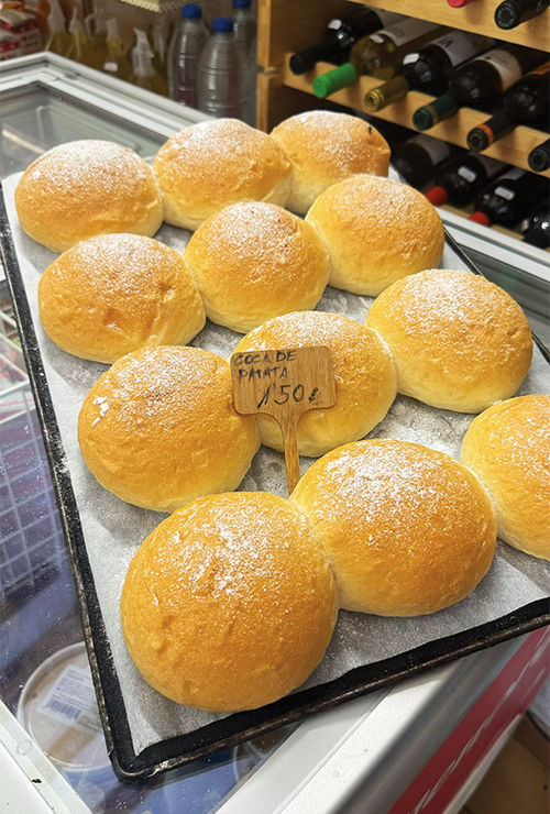A tray of freshly baked coca de patata. A tray of freshly baked coca de patata.