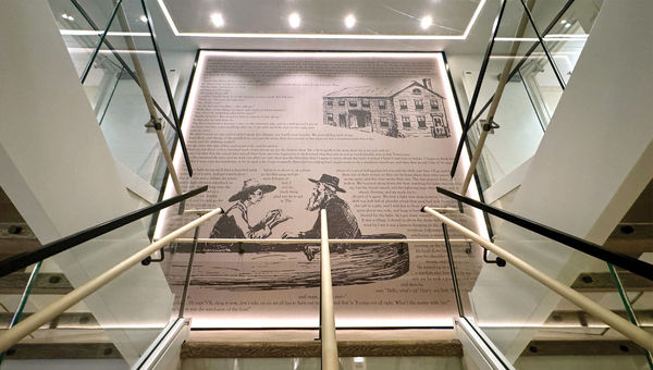An excerpt from Mark Twain's "Adventures of Huckleberry Finn" is a decorative backsplash in the main stairwell. An excerpt from Mark Twain's "Adventures of Huckleberry Finn" is a decorative backsplash in the main stairwell.