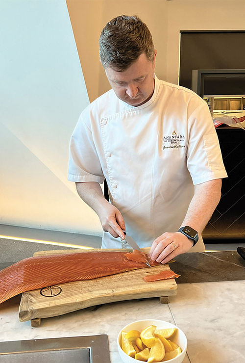 Anantara The Marker Dublin Hotel executive chef Gareth Mullins demonstrates the proper way to slice smoked salmon. Anantara The Marker Dublin Hotel executive chef Gareth Mullins demonstrates the proper way to slice smoked salmon.