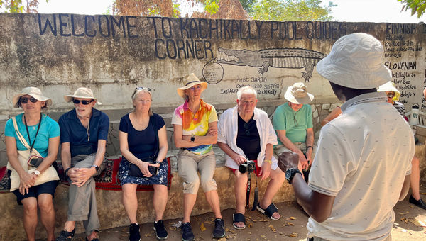 Guests at Kachikally Crocodile Pool in Banjul, the Gambia. Guests at Kachikally Crocodile Pool in Banjul, the Gambia.