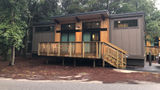The modern cabins at Fort Wilderness Resort and Campground have clerestory windows to provide natural light. The shed-style cabins come in a handful of colors.