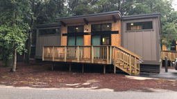 The modern cabins at Fort Wilderness Resort and Campground have clerestory windows to provide natural light. The shed-style cabins come in a handful of colors.