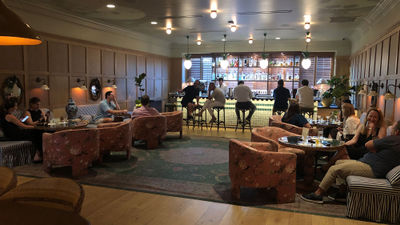 The lobby at the Palihouse Hyde Park Village doubles as a bar and a gathering space.