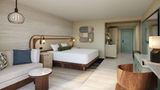 A rendering of a King Room at the Wyndham Grand Rio Mar Rainforest Beach & Golf Resort.