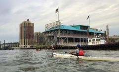 The pier in Yonkers, N.Y., with a kayaker bearing the initials for the Yonkers Paddling and Rowing Club on their life vest. Could this city, just up the Hudson River from Manhattan, one day host a river cruise ship?