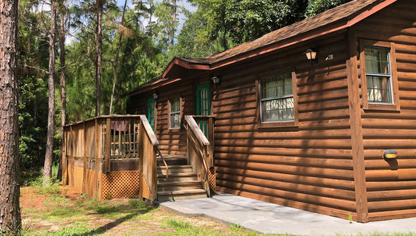 The old pioneer-style log cabin lodgings at Fort Wilderness Resort, which are being phased out, were uniformly dark brown. The old pioneer-style log cabin lodgings at Fort Wilderness Resort, which are being phased out, were uniformly dark brown.