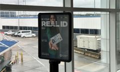 A message board at Charlotte International Airport reminding travelers to get a Real ID.